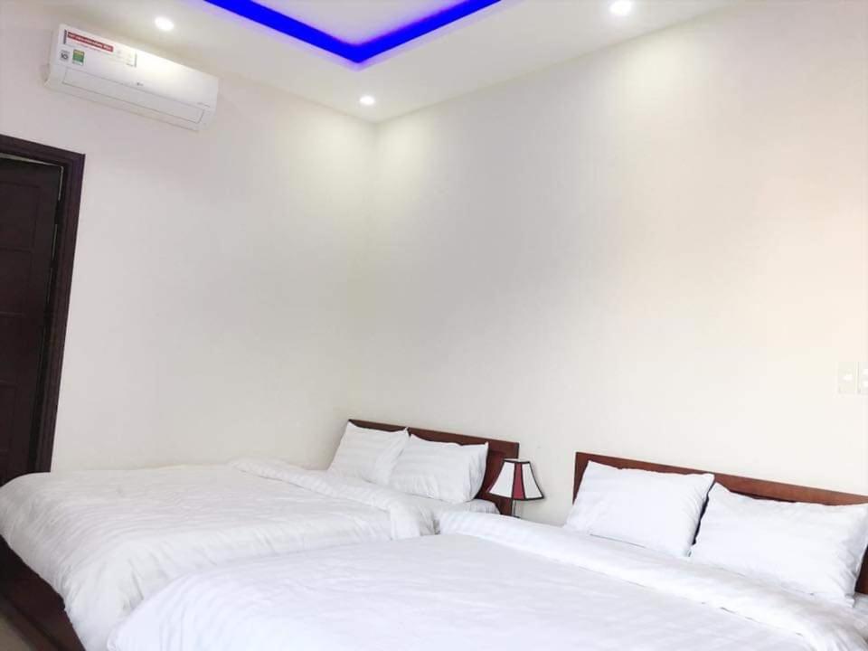 Postel nebo postele na pokoji v ubytování Motel Thanh Long