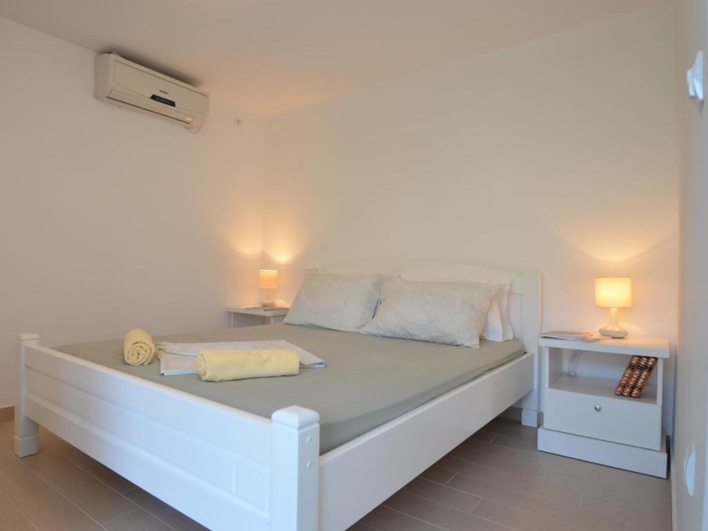 Uma cama ou camas num quarto em Apartments Kordić