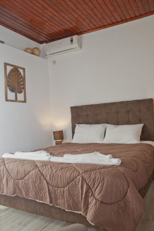 Postel nebo postele na pokoji v ubytování Danaos Hotel