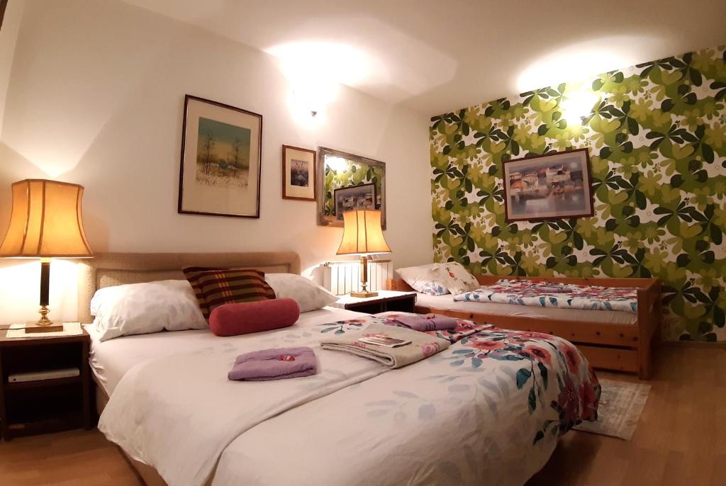 Postel nebo postele na pokoji v ubytování Hostel Pansion Lion