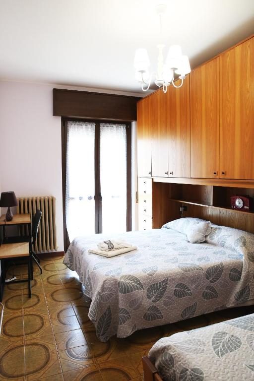 Posteľ alebo postele v izbe v ubytovaní appartamento delle rose