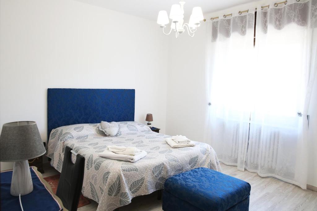 Posteľ alebo postele v izbe v ubytovaní appartamento delle rose