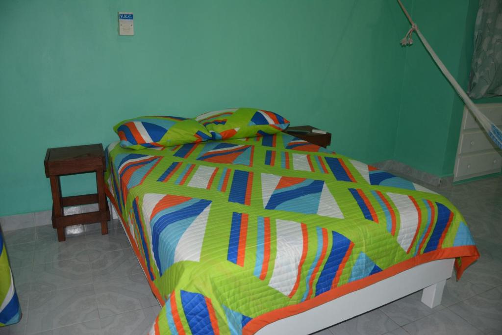 Uma cama ou camas num quarto em CASA MR CENTRO
