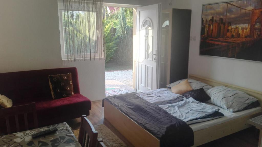 Posteľ alebo postele v izbe v ubytovaní Sunshine apartman