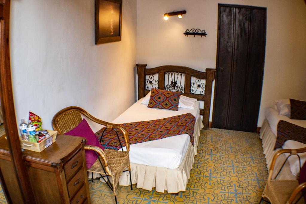 Postel nebo postele na pokoji v ubytování Casa Hotel Guaracú
