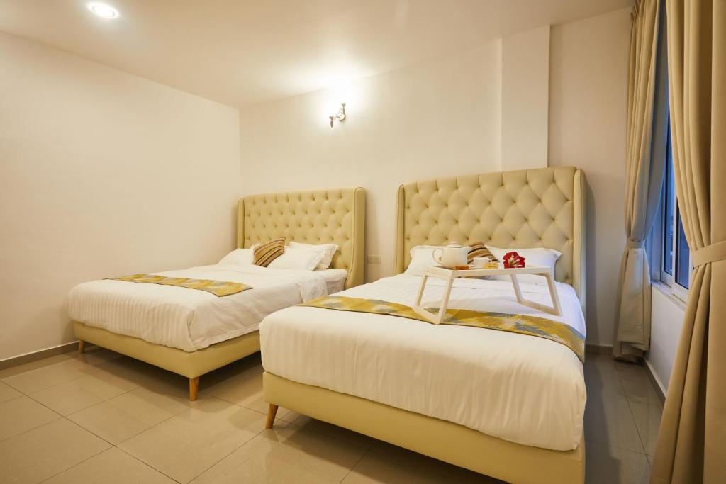 Postel nebo postele na pokoji v ubytování Ahn-Yi Residence