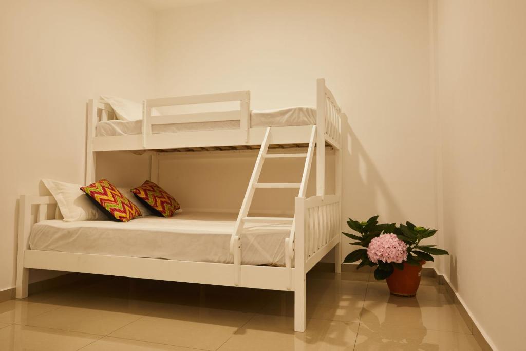 Postel nebo postele na pokoji v ubytování Ahn-Yi Residence