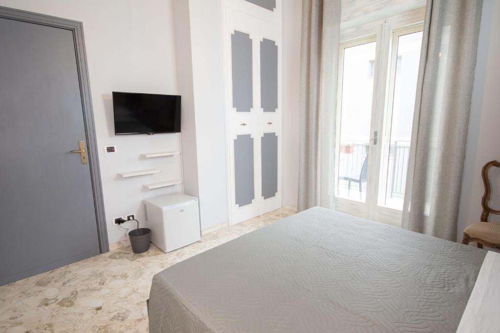Postel nebo postele na pokoji v ubytování Rudiae Boutique
