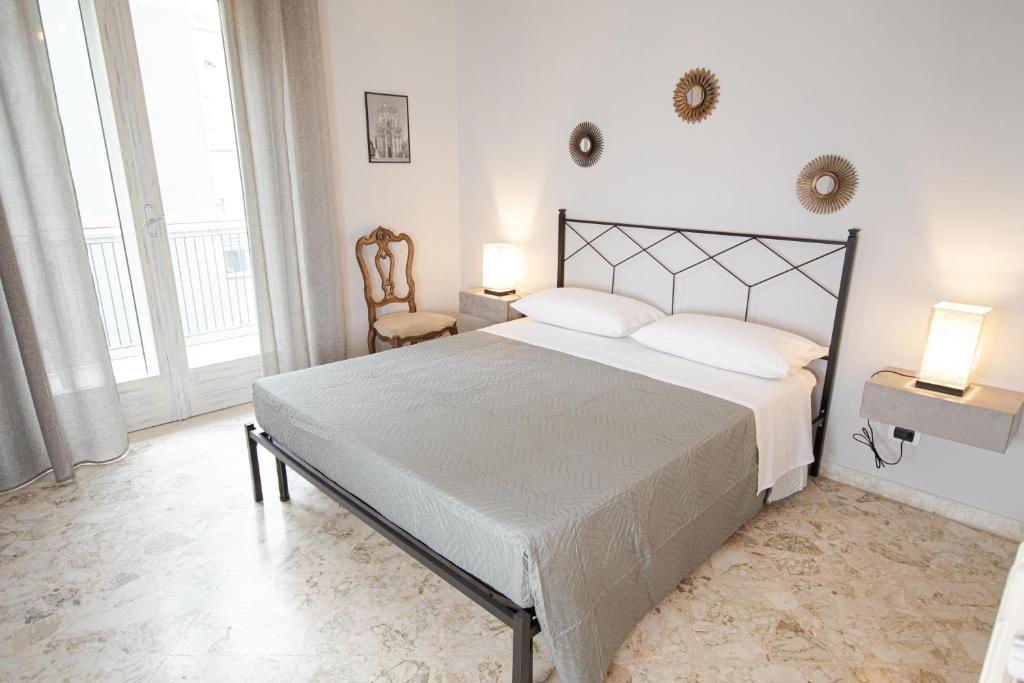 Postel nebo postele na pokoji v ubytování Rudiae Boutique
