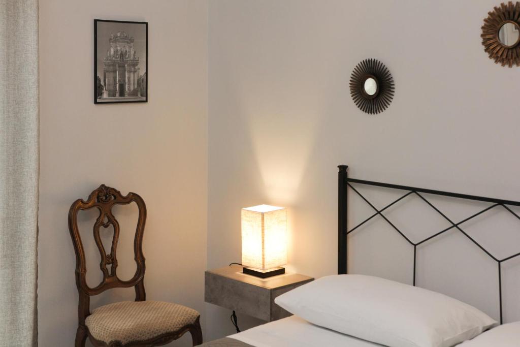 Postel nebo postele na pokoji v ubytování Rudiae Boutique