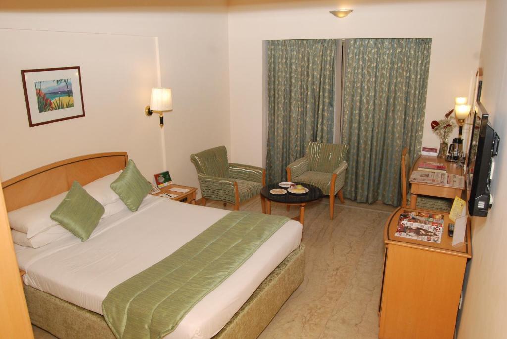 Postel nebo postele na pokoji v ubytování Beverly Hotel