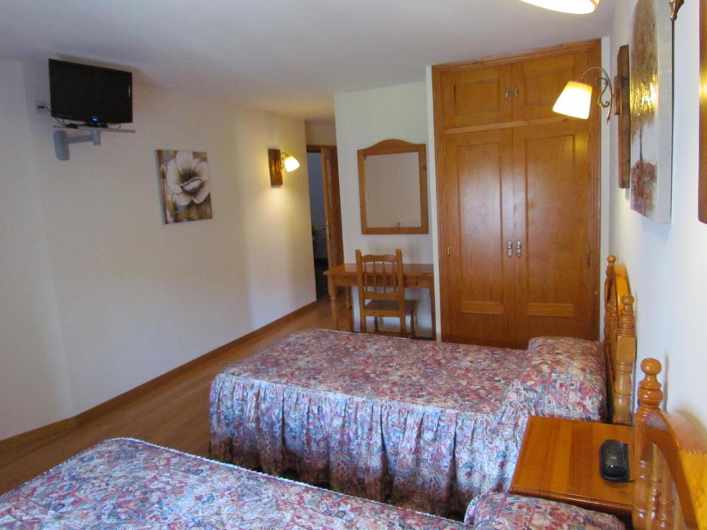 Postel nebo postele na pokoji v ubytování Hotel Las Nieves
