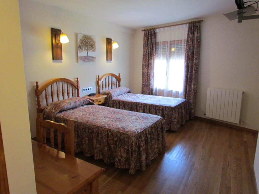 Postel nebo postele na pokoji v ubytování Hotel Las Nieves