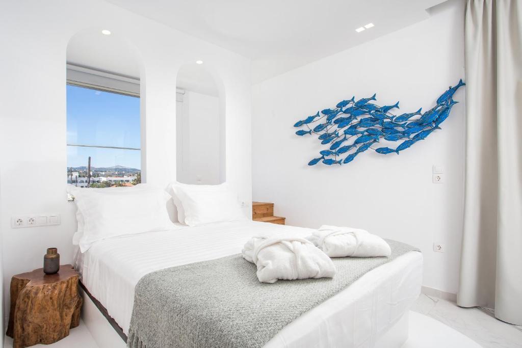 Posteľ alebo postele v izbe v ubytovaní Ammos Luxury Suites