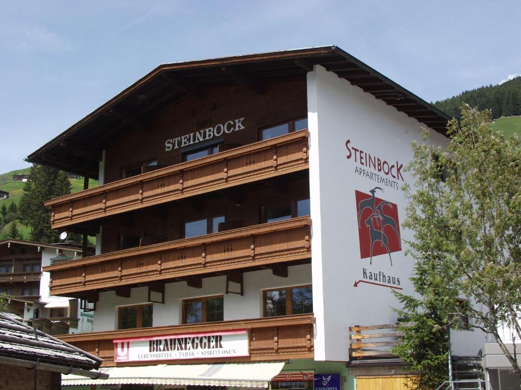 a building with a sign on the side of it at Appartements Steinbock - Ski-In & Ski-Out in Tux