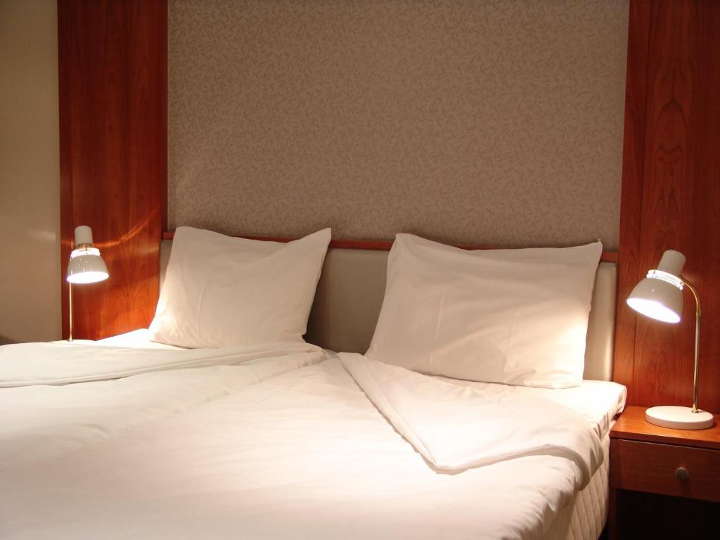 Postel nebo postele na pokoji v ubytování Alver Hotel
