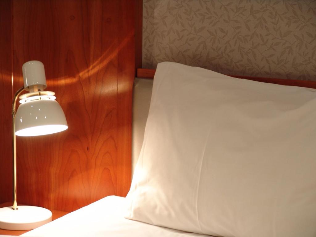 Postel nebo postele na pokoji v ubytování Alver Hotel
