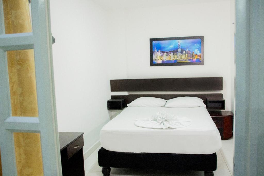 Postel nebo postele na pokoji v ubytování Hotel Palms Central