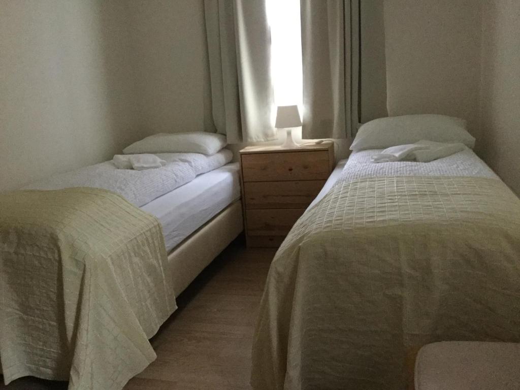 Postel nebo postele na pokoji v ubytování Guesthouse Stekkatún