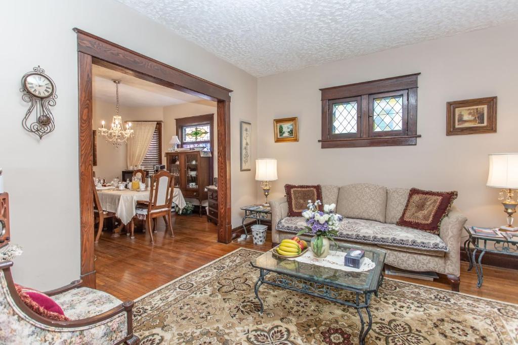 a living room with a couch and a table at Ambiance By The Falls B&B in Niagara Falls