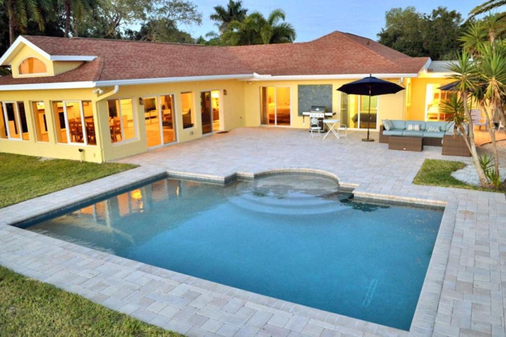 a swimming pool in the backyard of a house at Sarasota - Dunmore 8730 in Sarasota