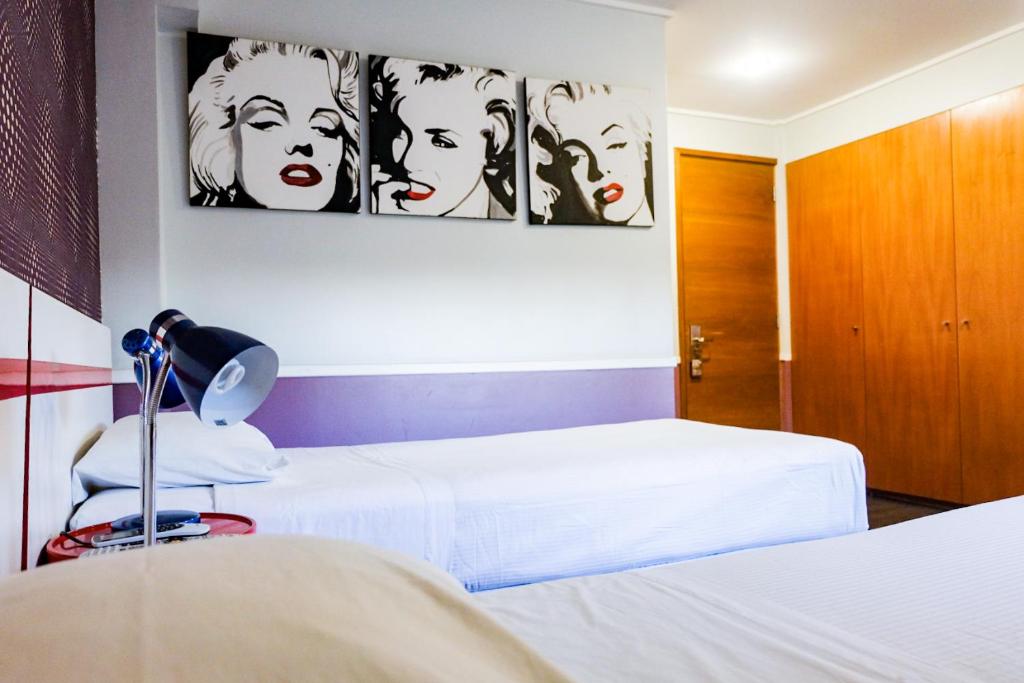 Postel nebo postele na pokoji v ubytování GUANAKO Hostel