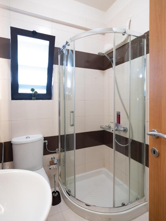 Kúpeľňa v ubytovaní Onyx city Center Apartment With parking