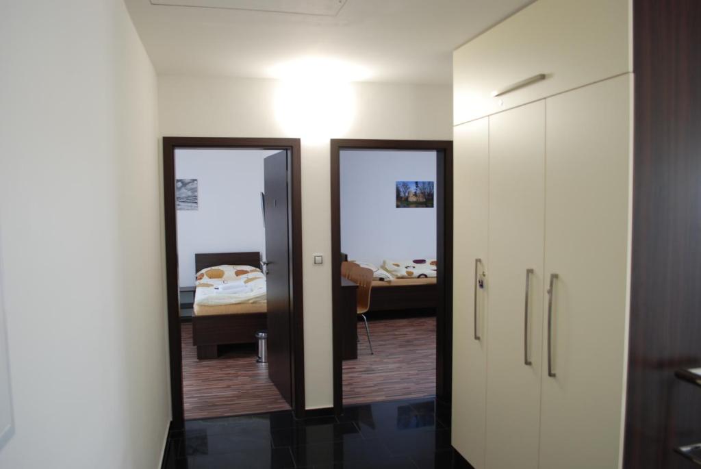 Postel nebo postele na pokoji v ubytování Penzion Na Dědině