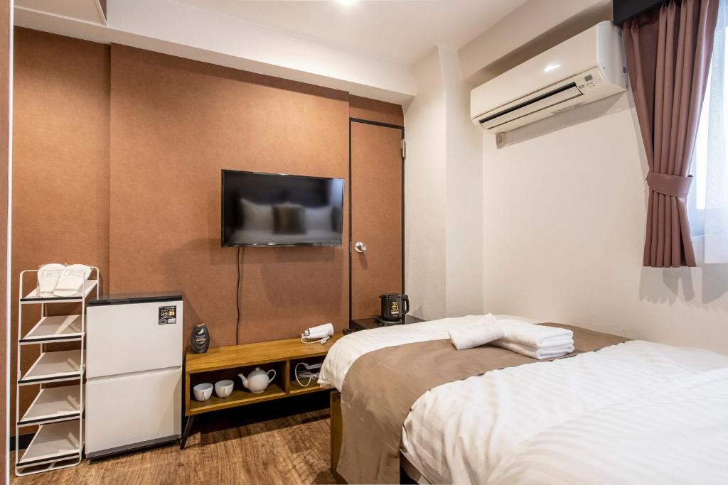 Postel nebo postele na pokoji v ubytování The Park Hotel Akihabara