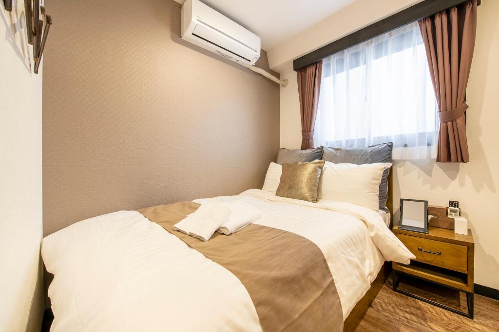 Postel nebo postele na pokoji v ubytování The Park Hotel Akihabara