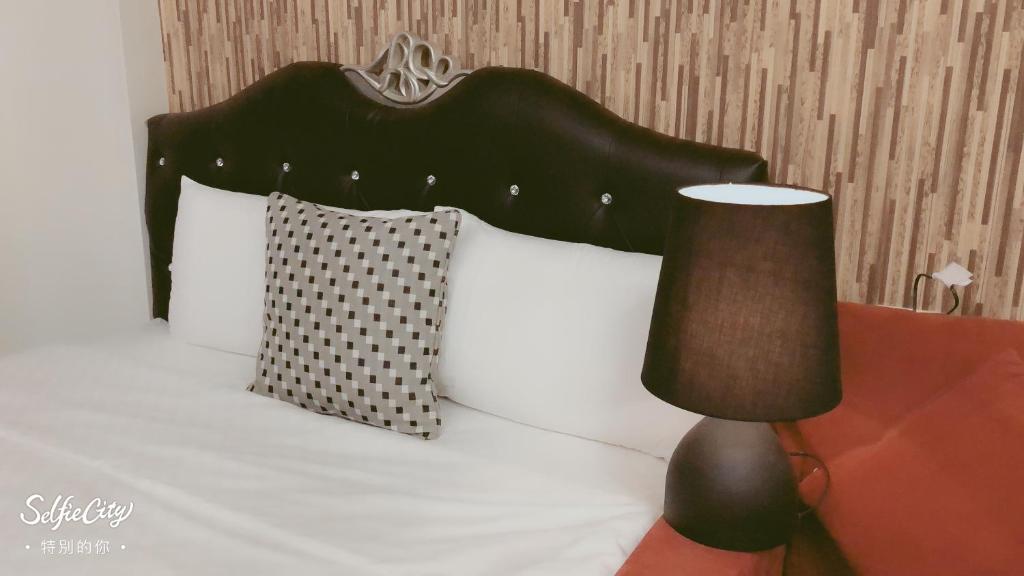 Postel nebo postele na pokoji v ubytování Redbean Guesthouse