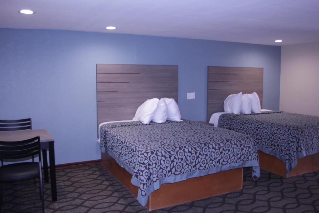 Postel nebo postele na pokoji v ubytování Americas Best Value Inn Port Aransas