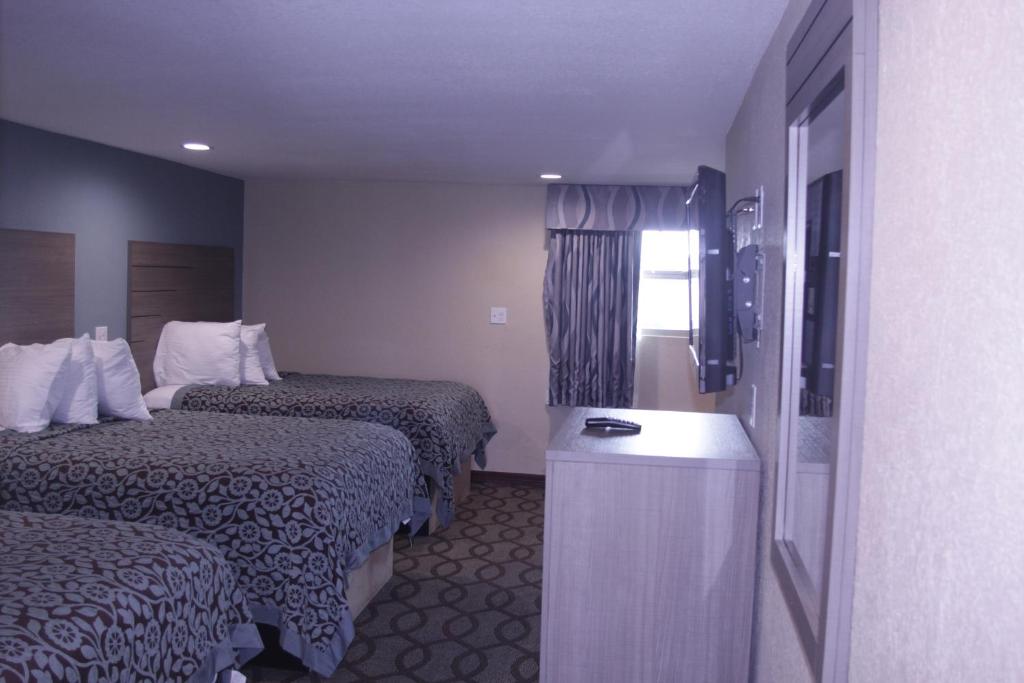 Postel nebo postele na pokoji v ubytování Americas Best Value Inn Port Aransas