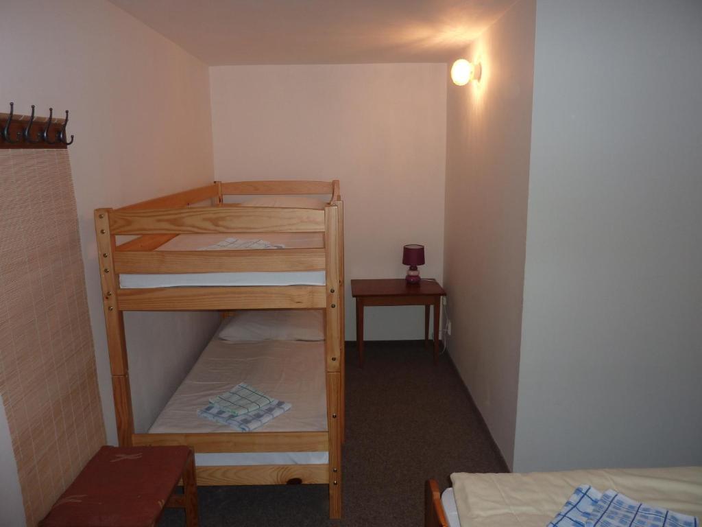 Postel nebo postele na pokoji v ubytování Hotel Flora Dolní Mísečky