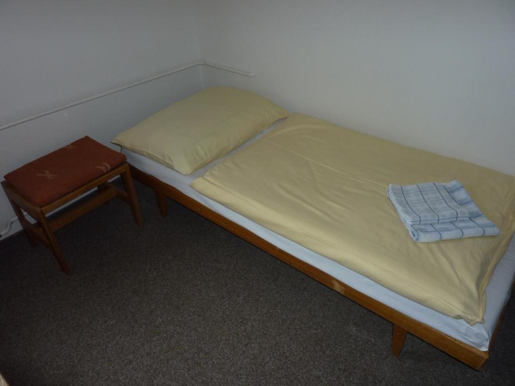 Postel nebo postele na pokoji v ubytování Hotel Flora Dolní Mísečky