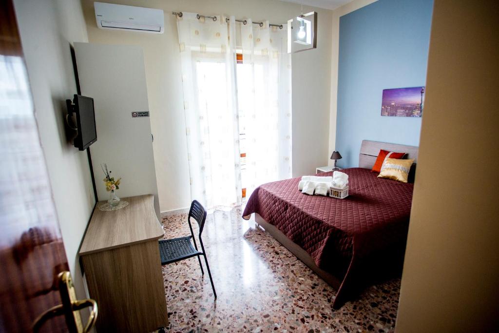 Postel nebo postele na pokoji v ubytování B&B L'Aurora CAPUA
