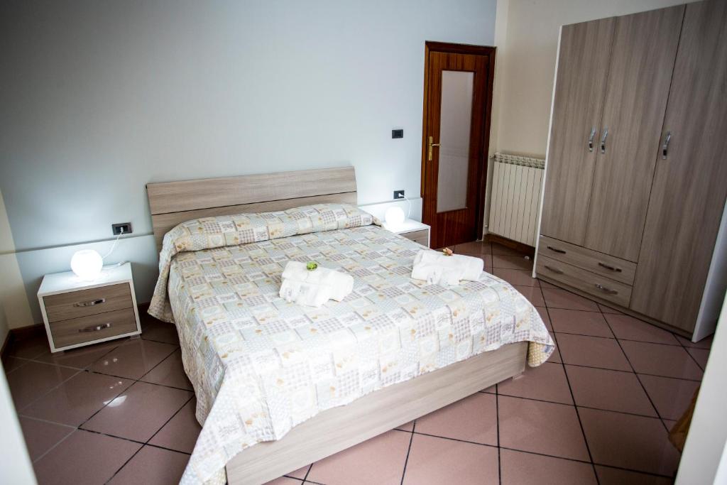 Postel nebo postele na pokoji v ubytování B&B L'Aurora CAPUA