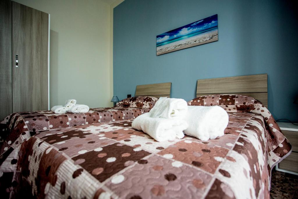Postel nebo postele na pokoji v ubytování B&B L'Aurora CAPUA