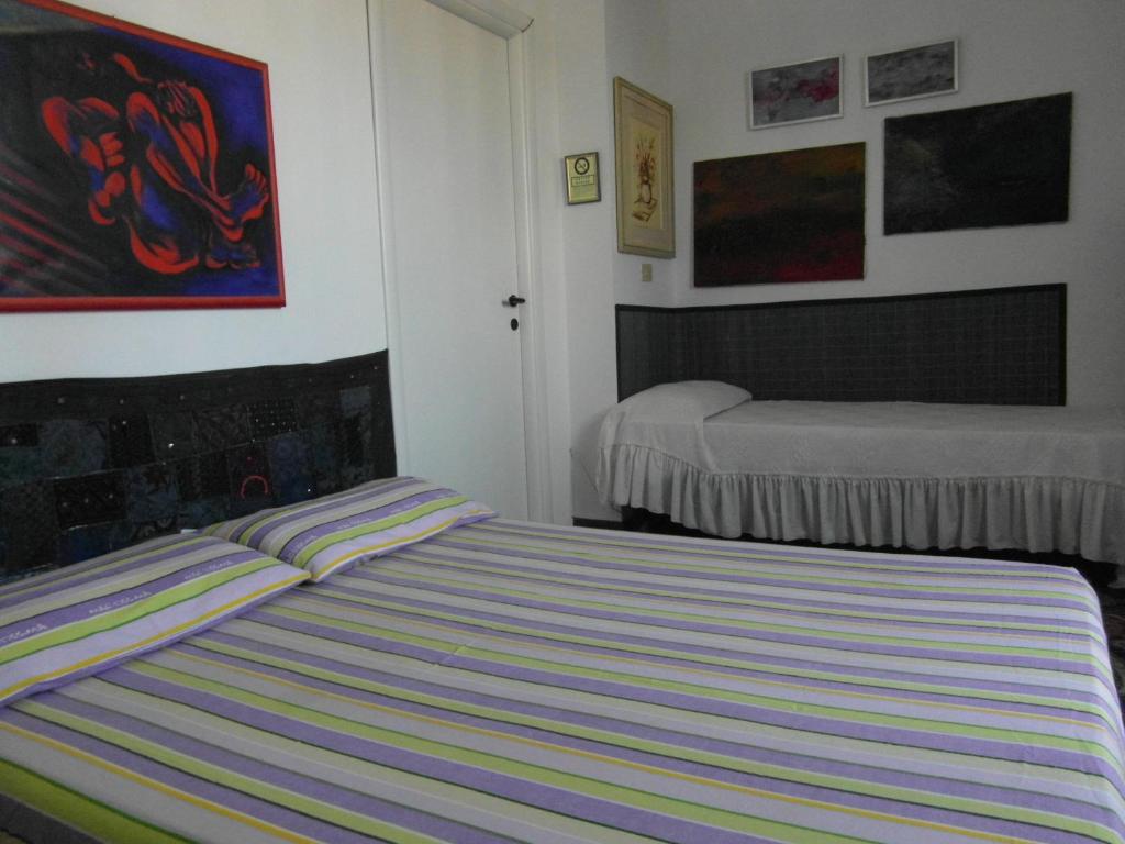 A bed or beds in a room at Abitazione Pigneto B&B