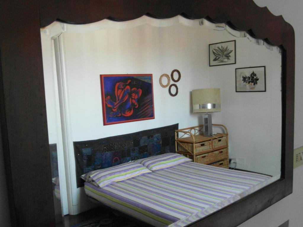 A bed or beds in a room at Abitazione Pigneto B&B