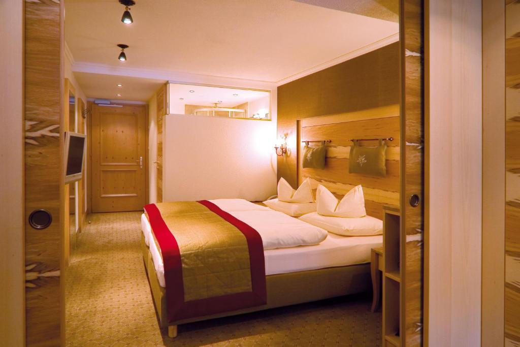 Postel nebo postele na pokoji v ubytování Hotel Rita