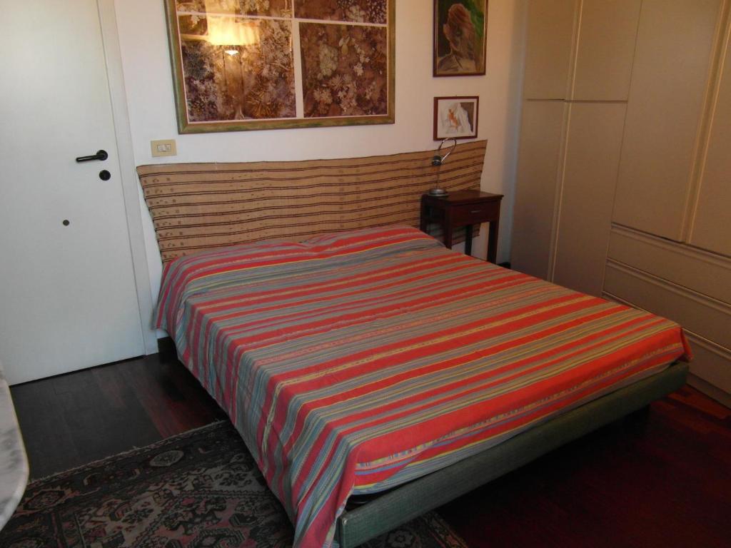 A bed or beds in a room at Abitazione Pigneto B&B