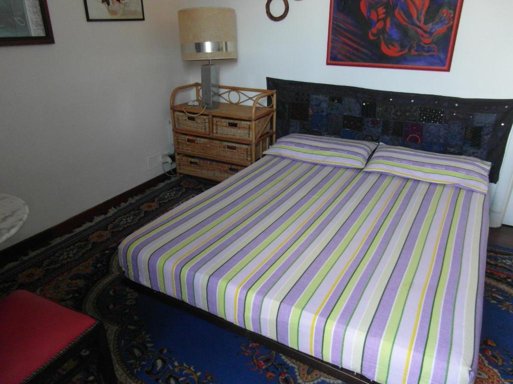 A bed or beds in a room at Abitazione Pigneto B&B