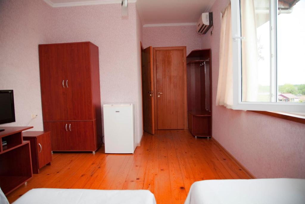 Postel nebo postele na pokoji v ubytování Hotel "Qeti"