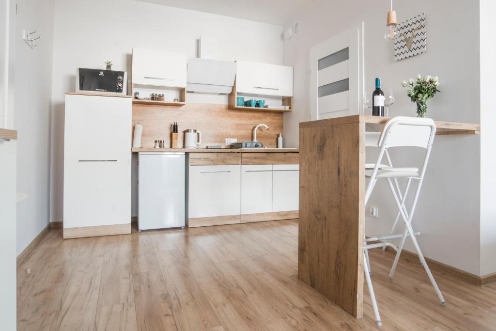 Kuchyňa alebo kuchynka v ubytovaní Unique Apartments - Browar Gdański