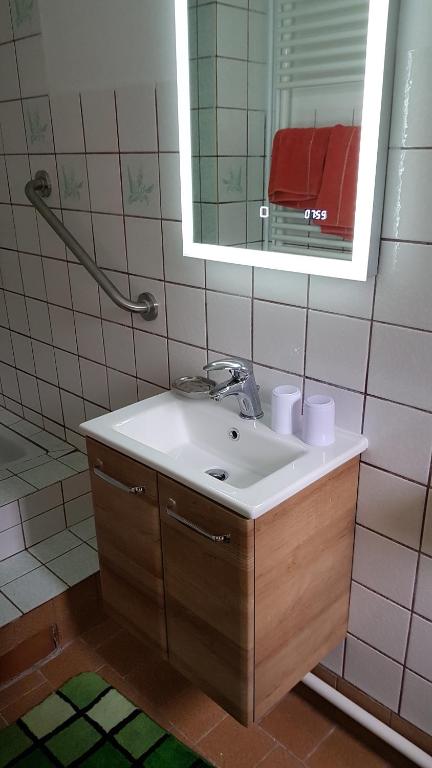 Ένα μπάνιο στο Ferienwohnung Baacke