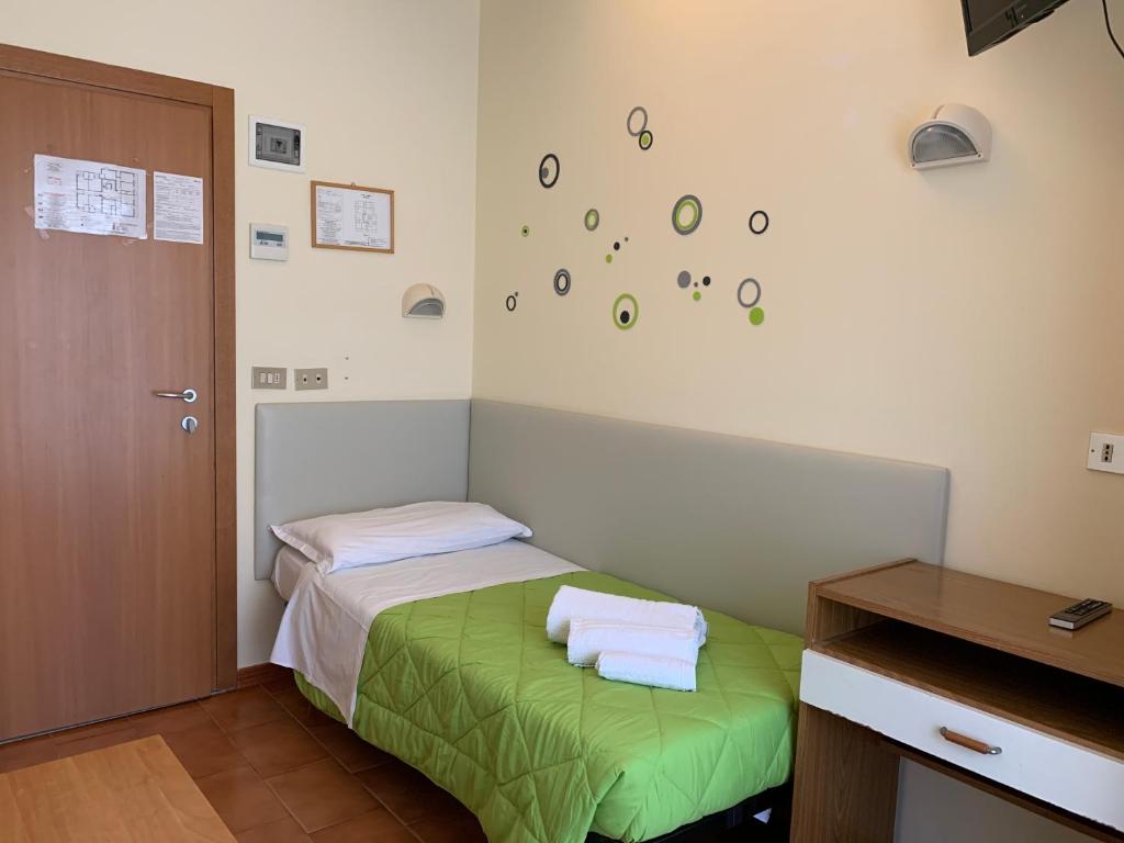 Postel nebo postele na pokoji v ubytování Hotel Palma Benessere