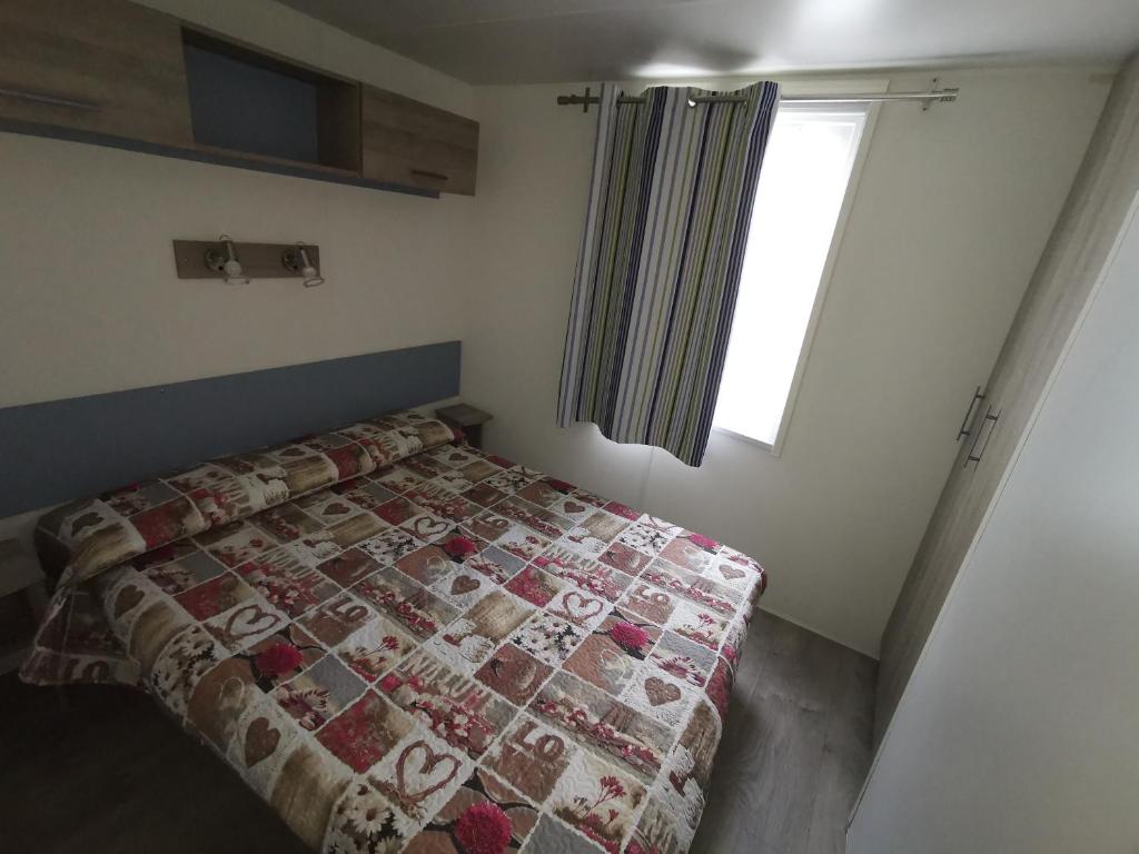 Postel nebo postele na pokoji v ubytování Camping Mare Monti