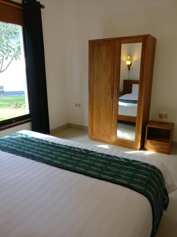 Postel nebo postele na pokoji v ubytování Dream Estate Resort