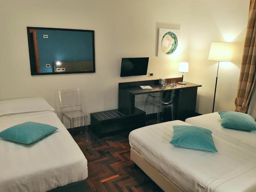 Postel nebo postele na pokoji v ubytování Locanda Giustini